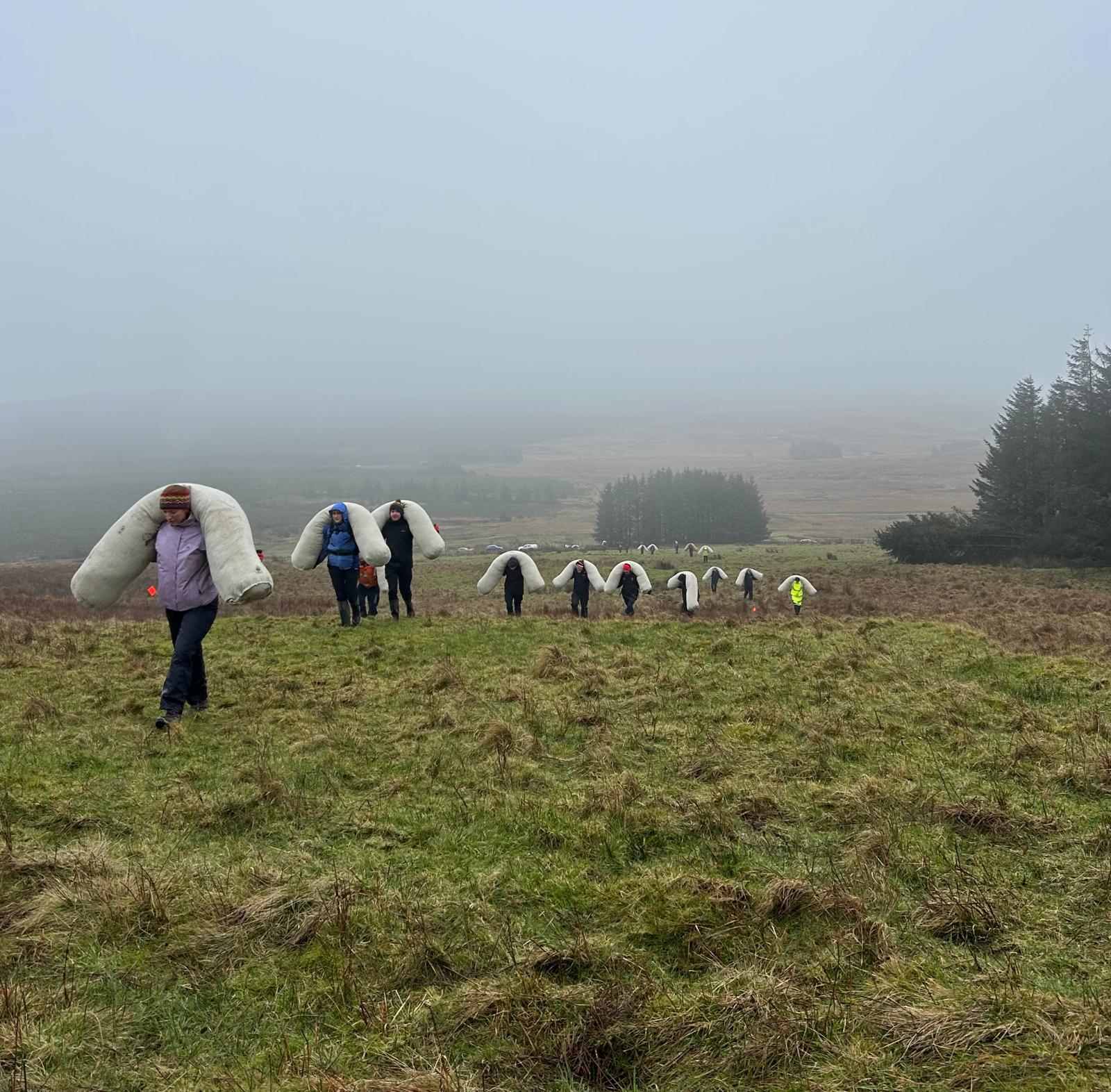 Volunteers carried 60 wool logs weighing 8kg onto site at Slievenanee Mountain